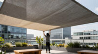 Heatherwick Studio and SPPARC shelter rooftop terrace with pleated canopy at London's Olympia